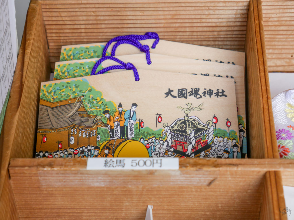 The wooden plaques, known as 'ema', on offer at Okunitama Shrine, Tokyo.