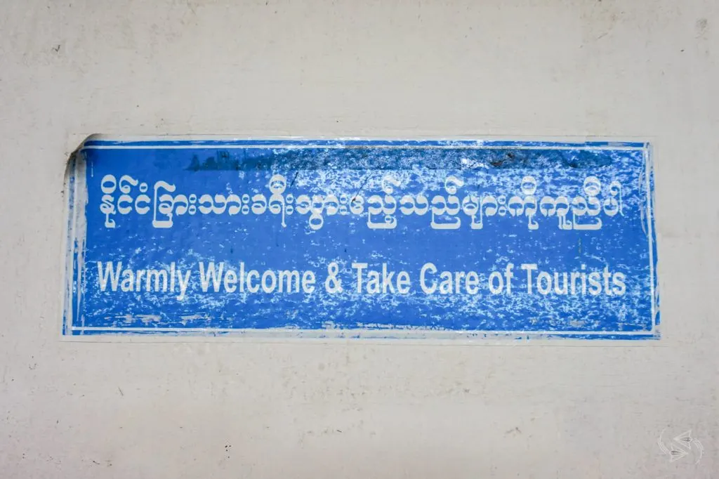 'Warmly Welcome & Take Care of Tourists' sign, Yangon Central Railway Station