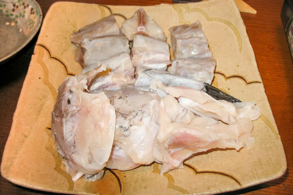 Raw migaki fugu, fugu with poisonous parts removed, sits on a plate at the home of the author's Japanese homestay in Tokyo.