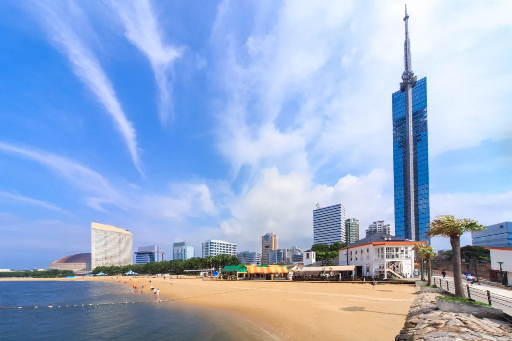 Momochi Beach flanked by Fukuoka Tower and the urban cityscape. 