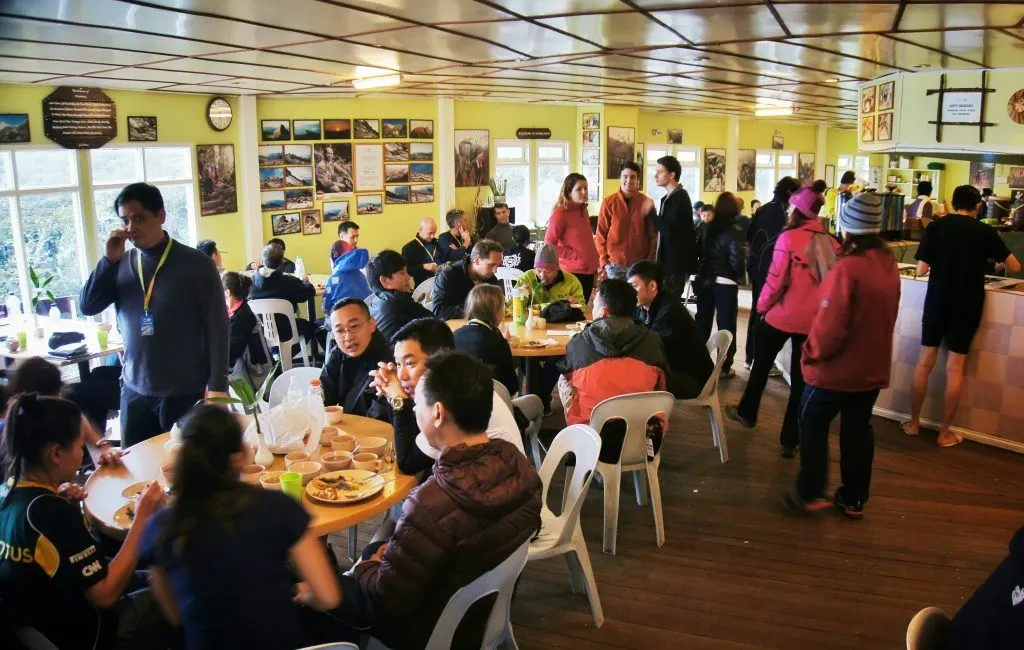 People congregated in the common eating area during dinner time at Laban Rata.