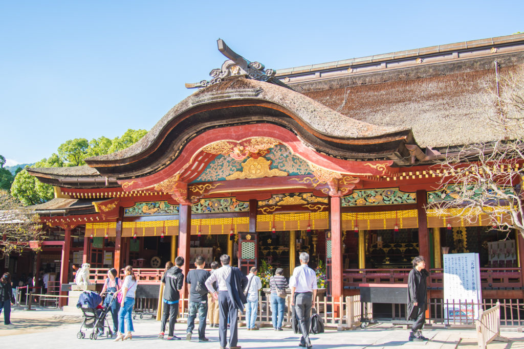 People praying at Dazaifu Tenmangu shrine.