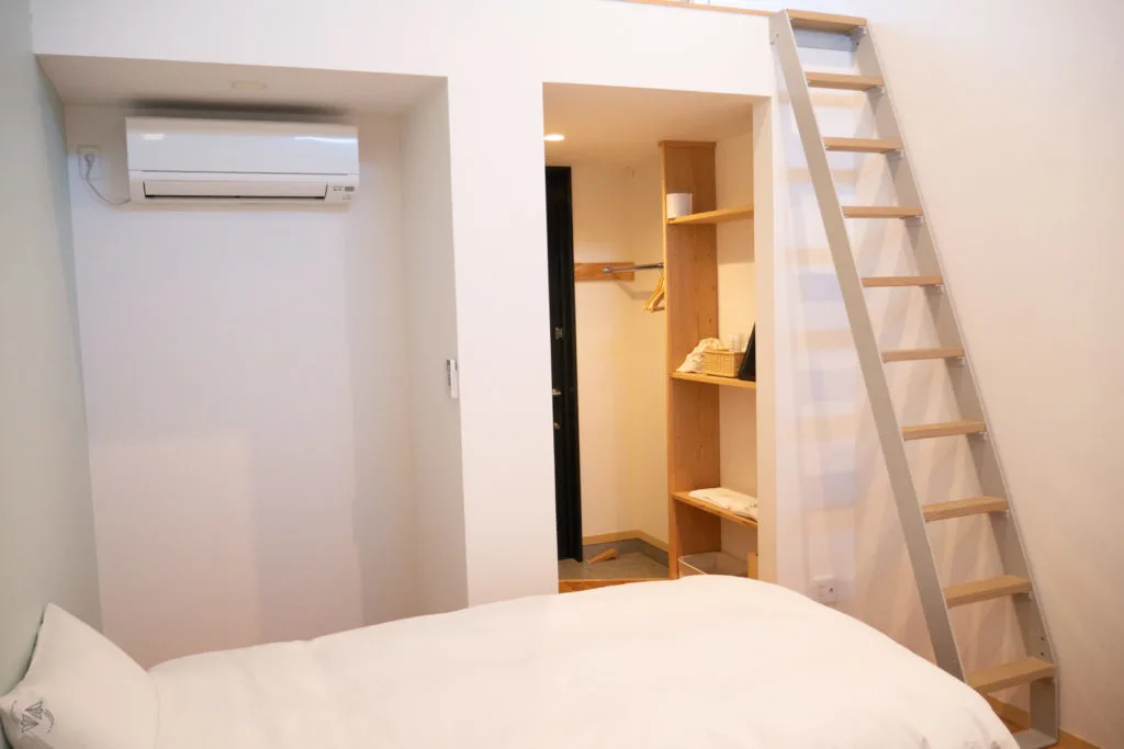 A steep ladder up to the loft and third bed in this Japanese apartment.