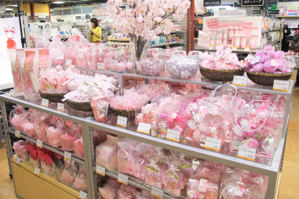 A White Day display in a department store filled with pink and white packaged bath products.